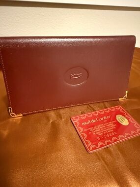 Cartier Burgundy Leather Slim Wallet with Gold Corners